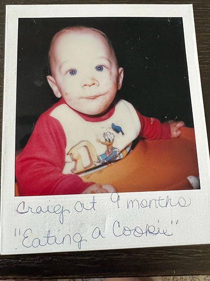 Myself at 9 months old eating a cookie